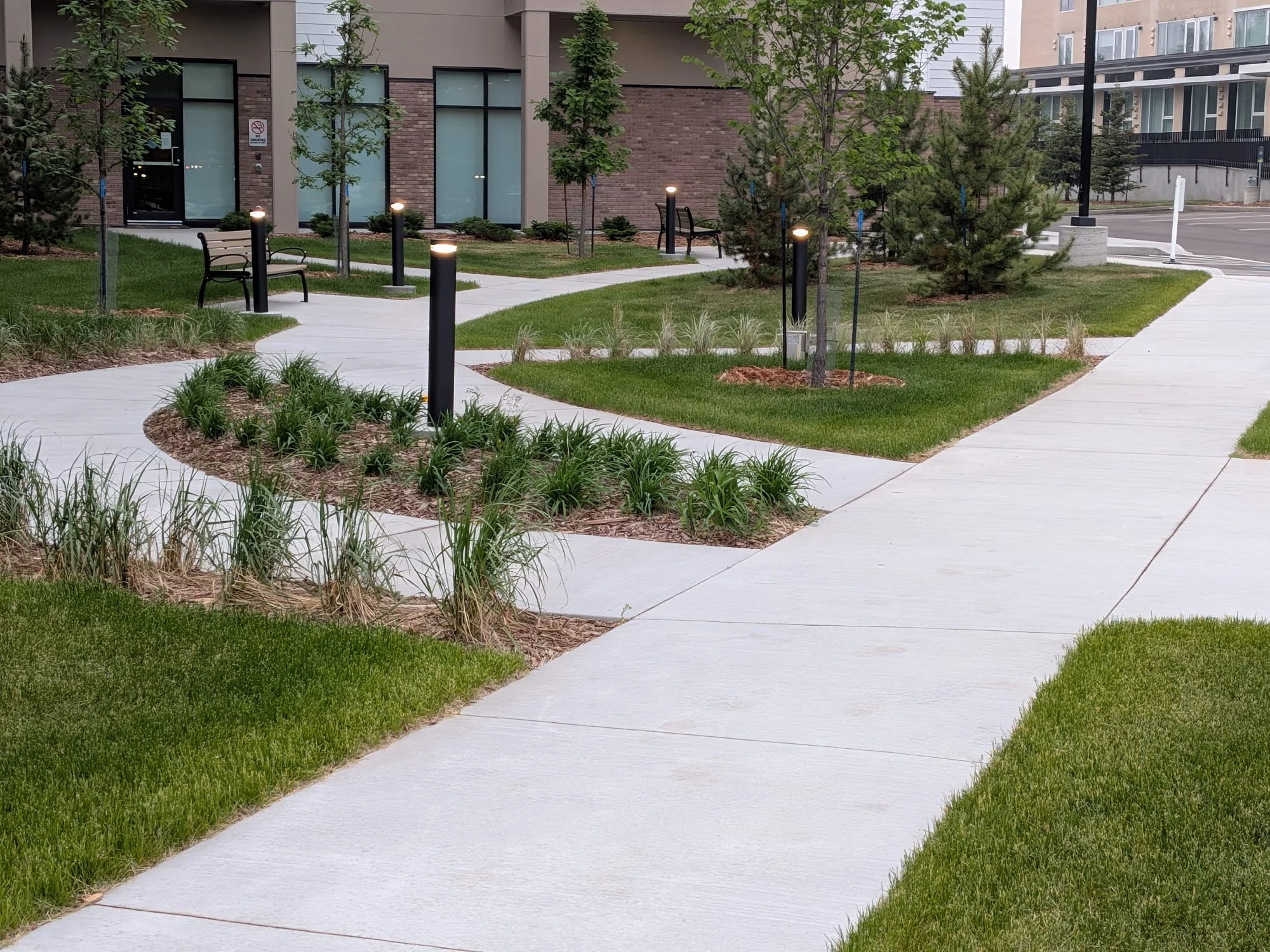 Landscaped beds around a residential courtyard