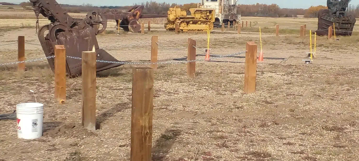 Wooden posts and chain enclosing an equipment display site