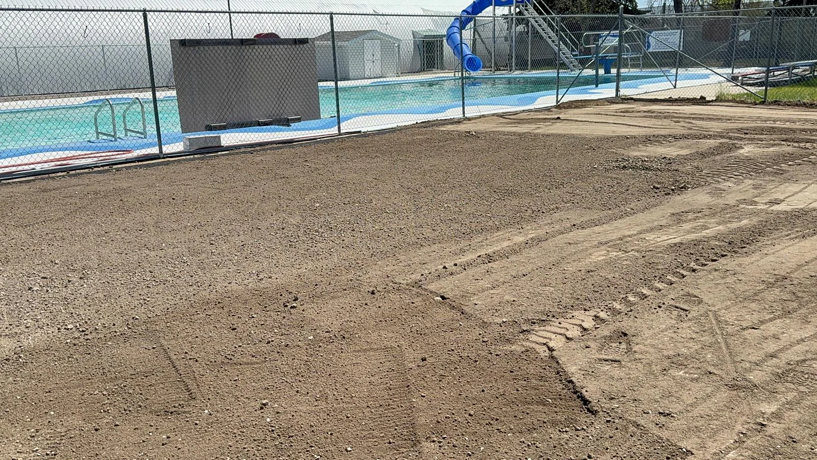 Soil grading beside the outdoor swimming pool